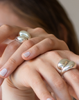 handmade-jewelry-merge-recycled-silver-cocoon-collection-in-hand.png