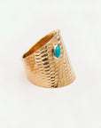 Angled side view of the Reptilia 14k gold ring with serpent-inspired scale texture.