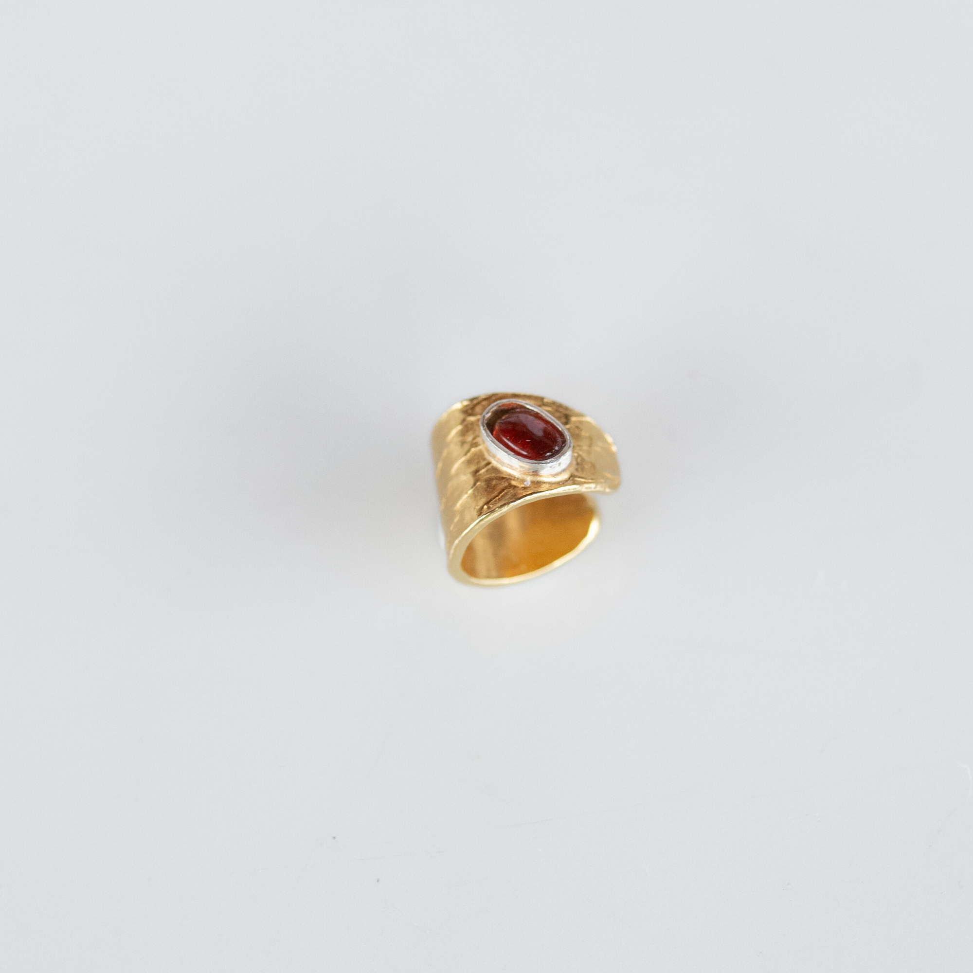 Reptilia vermeil earcuff with natural gemstone, front view.