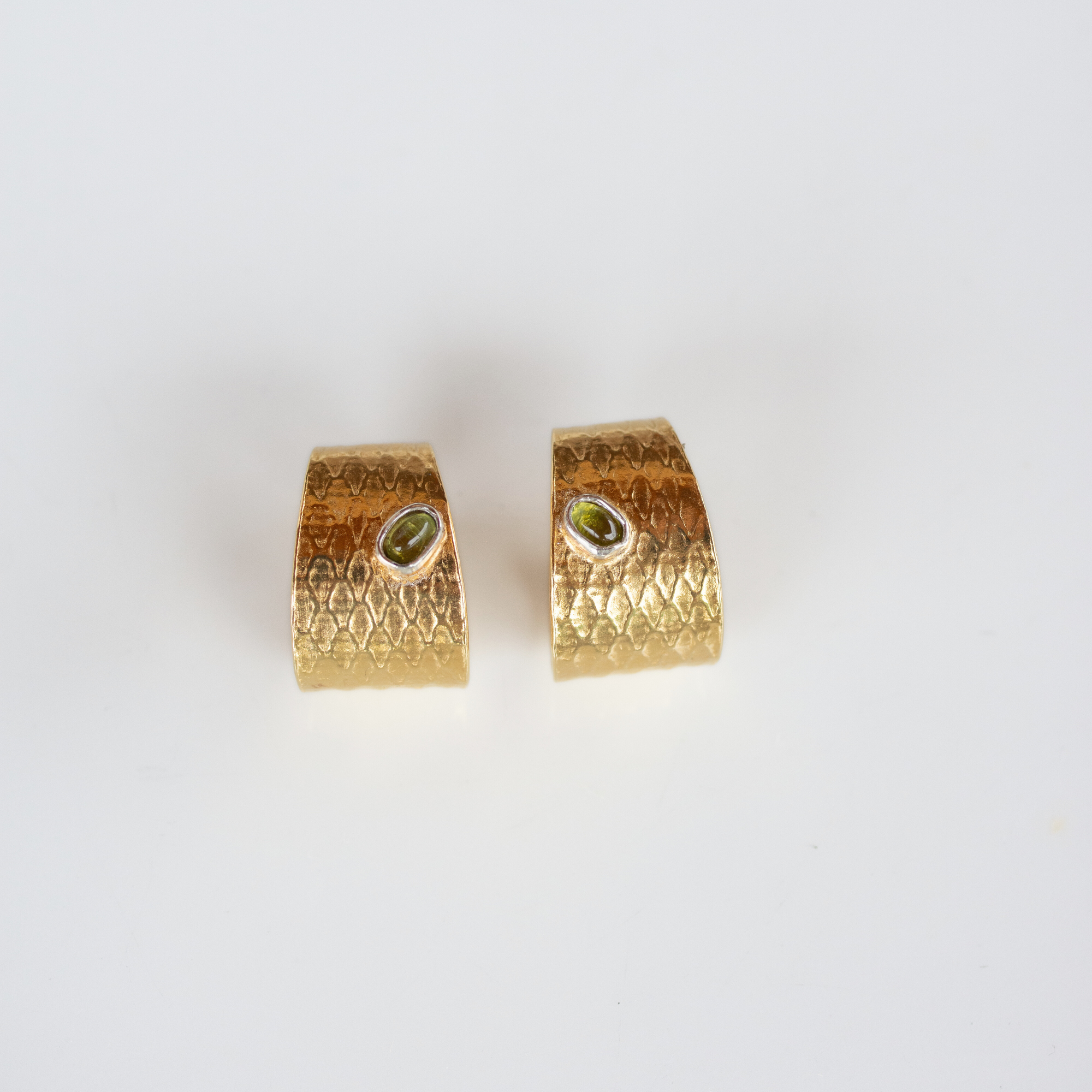 Reptilia vermeil earrings with peridot, front view of the pair.