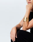 Model wearing the Reptilia Maxima vermeil cuff with lapis lazuli, on-wrist.