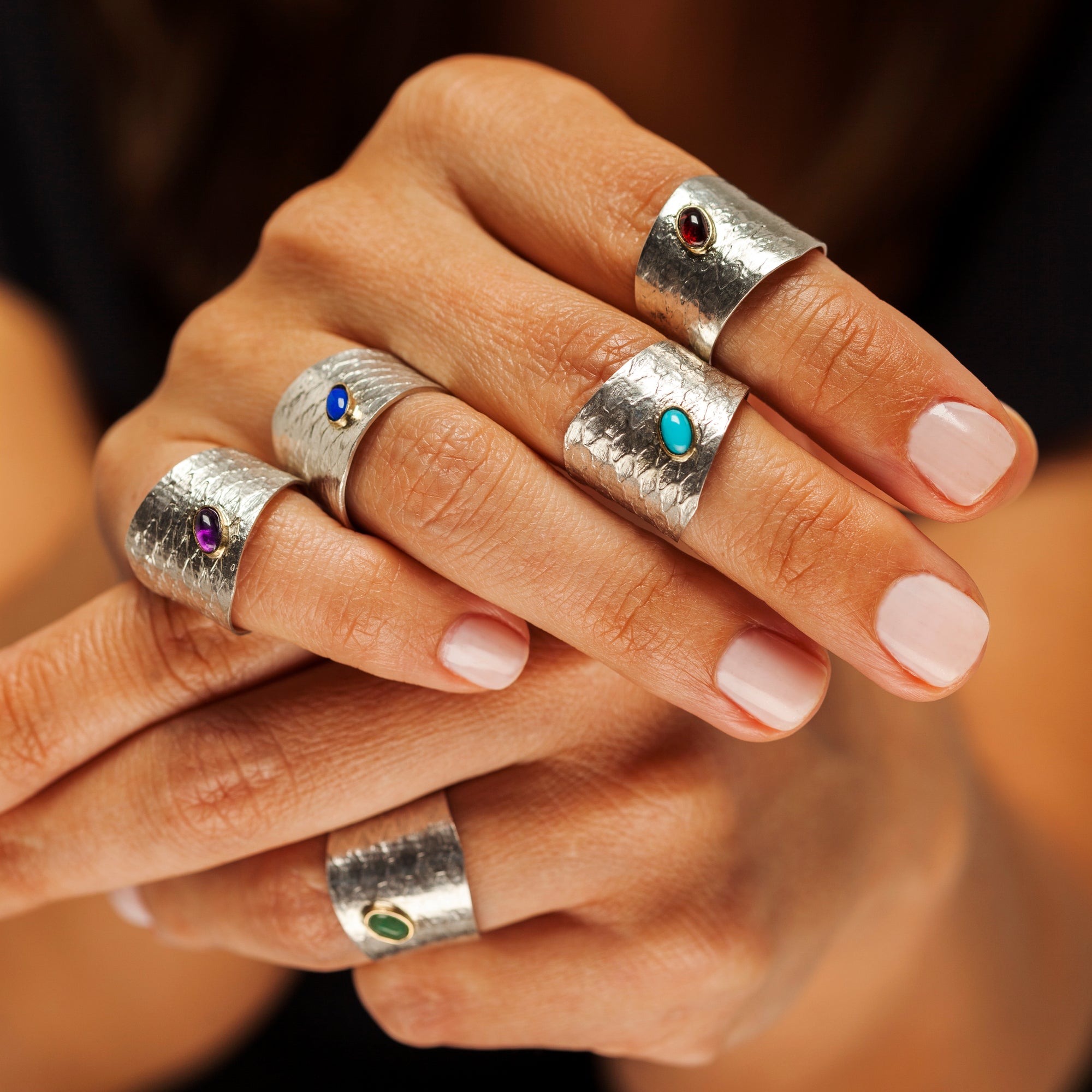 Close-up of the natural gemstone cabochon and bezel setting on the Reptilia silver ring.